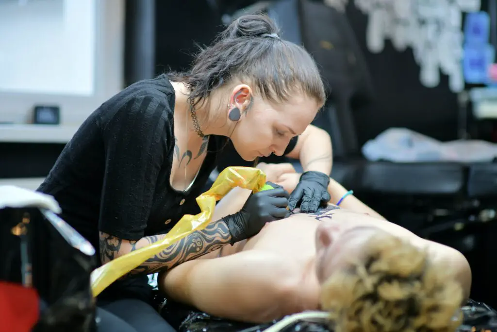How deep does a tattoo needle go?